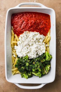 pasta with broccoli and sauce in a white dish