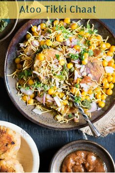 a bowl filled with food next to other dishes