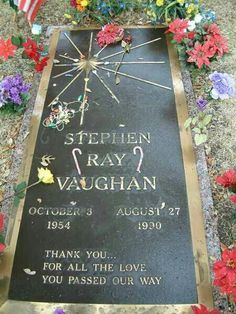 the grave of stephen ray vaughan is surrounded by flowers