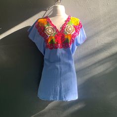 Embroidered Flower Design On Blue Woven Huipil Authentic Made In Mexico 100% Cotton New, Never Used, Without Tags 46” Bust Circumfrence 30” L From Top To Bottom Blue Floral Embroidery Beach Tops, Light Blue Floral Embroidery Tops For Vacation, Embroidered Flowers, No Brand, Flower Design, Flower Designs, Color Blue, Tags, Pink