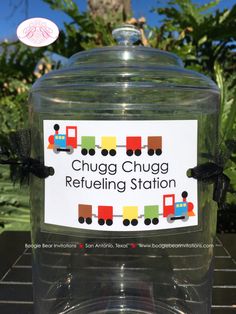 a glass jar with a label on it that says chug chug refueling station