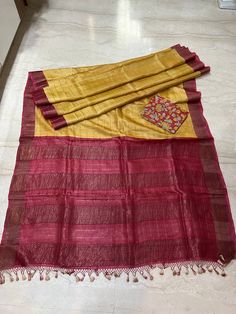 This beautiful Pure Gachhi Tussar silk saree with zari check on whole body snd zari red pallu with red zari border . A beautiful combinations of yellow and red .  Saree comes with kalamkari hand painted blouse piece of the border colour.   Fall and edging complimentary . Saree has silk mark certificate . Red Anarkali Blouse In Slub Silk, Red Slub Silk Blouse Piece With Zari Work, Slub Silk Pre-draped Saree With Kalamkari Print, Red Slub Silk Blouse With Cutdana, Red Slub Silk Blouse Piece With Cutdana, Diwali Blouse Piece In Slub Silk With Kalamkari Print, Kalamkari Print Slub Silk Blouse Piece For Diwali, Diwali Kalamkari Print Slub Silk Blouse Piece, Slub Silk Kalamkari Print Saree Blouse Piece