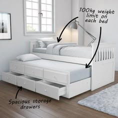 a white bed with drawers underneath it and an extra storage drawer on the bottom side