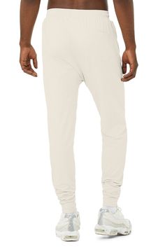 Next-level comfort meets street-smart design. The Revitalize Pant is made from our super-soft Alosoft performance fabric and has an extreme drop rise, on-trend tapered silhouette, pocket at back, elevated seaming and side-zip pockets. Zip pockets Moisture-wicking technology For working out and wearing out Elastic waistband with drawcords Wear-tested by our in-house team for the perfect fit Revitalize Pants in Bone, Size: Large | Alo Yoga® Casual Full-length Alo Yoga Pants, Alo Yoga Bottoms With Ribbed Waistband, Relaxed Fit Alo Yoga Pants, Alo Yoga Relaxed Fit Solid Color Pants, Alo Yoga Solid Color Pants With Elastic Waistband, Alo Yoga Sports Bottoms With Elastic Waistband, Alo Yoga Relaxed Fit Bottoms With Comfort Waistband, Functional 4-way Stretch Alo Yoga Bottoms, Alo Yoga Relaxed Fit Pants With Elastic Waistband