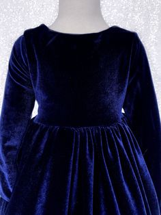 The perfect dress for a fancy and formal occasion such as weddings, birthdays, graduations and photoshoots! This stretch velvet dress comes with long sleeves and a v-back. The zipper can be found on the back of the dress. The stretchy material makes it for a comfortable fit. Underneath the bottom of the stretch velvet skirt is a layer of lining with crinoline attached for added shape. *Mannequin has petticoat to show detail. !PETTICOAT NOT INCLUDED! LINK TO PURCHASE PETTICOAT: https://www.etsy.c Formal Flower Girl, Wedding Bridesmaid Flowers, Stretch Velvet Dress, Navy Blue Gown, Formal Chic, Blush Gown, Long Sleeve Velvet Dress, Blue Velvet Dress, Marine Uniform