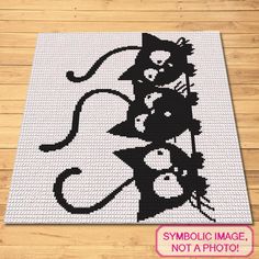 a black and white cat rug on top of a wooden floor with the words symbolic image not a photo