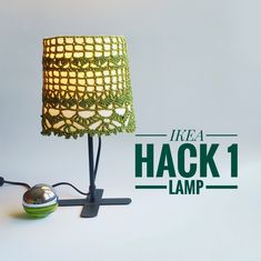 a lamp that is sitting on top of a table next to a light bulb with the words ikea hack 1 lamp underneath it