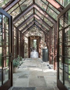 an instagram photo of a bride and groom in a glass walled room with doors