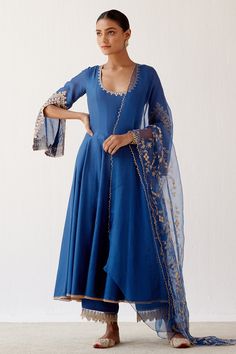 Blue anarkali with dori embroidered split sleeves. Paired with embroidered hem palazzo and cutwork dupatta.
Component: 3
Pattern: Embroidered
Type Of Work: Dori
Neckline: Scoop
Sleeve Type: Split Sleeves
Fabric: Cotton silk blend, Shantoon and organza
Color: Blue
Other Details: 
Back tassel tie-up
Dori work
Occasion: Wedding - Aza Fashions Blue Anarkali, Embroidery Boutique, Embroidered Anarkali, Blouse Measurement, Designer Jumpsuits, Sharara Set, Organza Dupatta, Indian Outfit, Indian Designer Wear