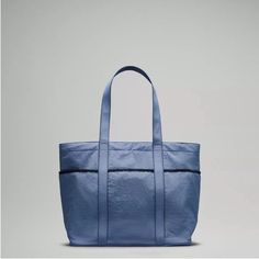 Blue Oasis Color! Nwt. Water Repellant Material. This Color Is No Longer Made. Dimensions: 51cm X 15cm X 35cm (20.1" X 5.9" X 13.8") Volume: 20l Waterproof Blue Nylon Bags, Blue Bags With Functional Pockets For On-the-go, Blue Nylon Bag With Functional Pockets, Blue Bags With Zipper Pocket For Outdoor Activities, Sporty Everyday Bag With Side Pockets, Practical Blue Nylon Bag, Blue Waterproof Travel Bag, Functional Blue Nylon Bags, Versatile Blue Bags With Functional Pockets