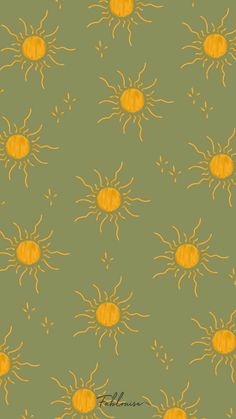 a green background with yellow sun designs on it