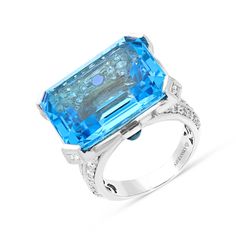 24.80 carat Emerald cut Blue topaz
0.60 carat cabochon round cut Sapphires
1.25 carat diamond pave setting
18k white gold Luxury Blue Topaz Ring In Platinum, Luxury Light Blue Brilliant Cut Topaz Ring, Luxury Light Blue Topaz Ring With Center Stone, Blue Octagon Sapphire Ring With Diamonds, Luxury Octagon Brilliant Cut Topaz Ring, Octagon Topaz Ring With Diamond For Formal Occasions, Formal Blue Topaz Platinum Ring, Blue Octagon Sapphire Ring With Brilliant Cut, Blue Octagon Brilliant Cut Sapphire Ring