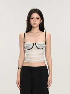 Embrace the mix of simplicity and allure with our Ruched Bustier Crop Top with Slim Straps. Its fitted silhouette and structured design offer a chic street-style edge. Crafted with a focus on texture, this crop top features delicate ruching that accentuates your shape, while the solid color design maintains a versatile and sophisticated look. The slim straps and bustier-style bodice are not just design elements; they provide support and enable a fit that's both flattering and comfortable. Whethe Fitted Ruched Bandeau Crop Top, Chic Tops With Medium Bust Support, Trendy Fitted Bra-friendly Tube Top, Chic Cropped Tube Top With Boned Bodice, Chic Camisole Top With Removable Bra Pads, Chic Fitted Tank Top With Removable Bra Pads, Chic Fitted Tank Top With Boned Bodice, Chic Summer Crop Top With Boned Bodice, Chic Boned Bodice Crop Top For Summer