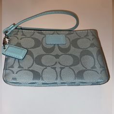 Light Aqua Blue Small Wristlet In Logo C Cloth Fabric W Matching Zipper And Silver Clip Hardware New Without Tags Coach Mini Skinny Wristlet Coin Purse In Light Aqua New Without Tags It Has Been Stored & Is Very Lovely & Special And It Reply Pops! - Silver Hardware Clip On Wristlet Step And Key Ring On Side Which Wristlet Loops Onto Approx 5.5” X 3.5 X 1 Very Small And Perfect For Cards Keys And Cash For The On The Go Girl! Blue Bags With Wrist Strap For Daily Use, Coach Blue Pouch Wristlet, Blue Coach Pouch Wristlet, Blue Coach Wristlet For Daily Use, Coach Blue Wristlet For Travel, Coach Blue Wristlet For Daily Use, Blue Rectangular Bag With Wrist Strap, Coach Blue Clutch For Everyday Use, Blue Coach Clutch For Everyday Use