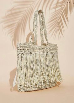 Expertly crafted with a woven design, this shoulder tote bag is both stylish and functional. The addition of fringe detailing adds a touch of elegance while providing extra storage space for your belongings. The versatile beige color makes it the perfect accessory for any outfit. Extra Storage Space, Woven Design, Shoulder Tote Bag, Extra Storage, Shoulder Tote, Beige Color, Storage Space, Tote Bag, Color