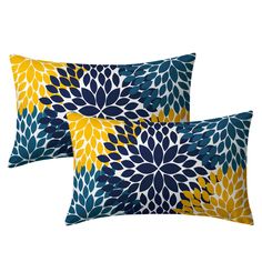 two blue and yellow pillows with flowers on them