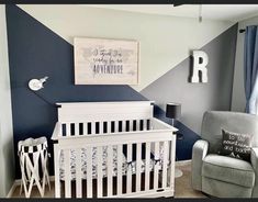 a baby's room with blue and gray walls