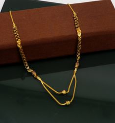 22karat gold solid handmade chain necklace with gorgeous black color beads ,Excellent brides personalized gifting mangalsutra chain necklace available in different sizes , normally its looks fabulous on girls, brides or women's. Metal-22karat yellow gold. Item type-Mangalsutra chain. Purity-91.6% gold purity Marking-916/22k hallmarked. Width of ball-3mm approx. Weight-10.800 grams to 14.5 grams approx., Length-18 to 24 inches. Makes excellent gifting and collectible pieces. Half Gold Chain Mangalsutra, Traditional Wedding Necklace With Delicate Chain, 22k Gold Beaded Chain Necklace As Gift, 22k Gold Necklace With Beaded Chain For Gift, 22k Gold Beaded Chain Necklace For Gift, 22k Gold Beaded Chain Necklaces For Gift, Black 22k Gold Necklace For Weddings, Traditional 22k Gold Necklace With Delicate Chain, Luxury Yellow Gold Mangalsutra For Festive Occasions