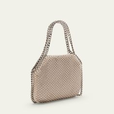 Stella McCartney "Falabella" shoulder bag in allover eco crystal and mesh fabric  Chain top handles with logo disc charm  Chain shoulder strap Can be worn as a top handle or shoulder bag  Open top with magnetic closure  Interior, one card slot  Lining: Satin Approx. 5.9"H x 7.3"W x 2"D Item Weight (Lbs.): 1.0 Made in Italy Top Handle Chain Shoulder Bag For Party, Party Shoulder Bag With Chain And Top Handle, Luxury Chain Bag For Events, Elegant Evening Shoulder Bag With Chainmail, Elegant Chainmail Bag, Top Handle Evening Bag With Chain Strap, Evening Shoulder Bag With Detachable Chain Link Strap, Rectangular Evening Bag With Chainmail, Rectangular Chainmail Evening Bag