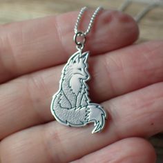 Crafted from sterling silver, this pendant measures 33mm in length and 18mm in width, capturing the intricate details of a fox's form.The fox is a symbol of resourcefulness and adaptability in nature, revered for its cleverness and ability to thrive in various environments. Our Fox Charm Necklace celebrates these qualities, serving as a wearable emblem of nature's wonder and the wisdom of the wild. Sterling Silver Necklace With Wolf Design As Gift, Sterling Silver Wolf Design Necklace As Gift, Sterling Silver Necklace With Wolf Design For Gift, Fox Necklace, Silver Wolf Design Pendant Necklace, Fox Pendant Necklace, Wolves Pendants, Silver Fox, Recycled Silver