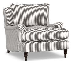 a black and white striped chair with wooden legs