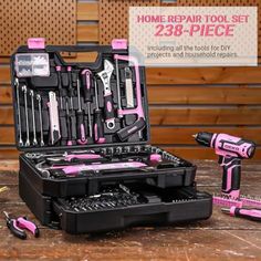 pink and black tool kit with tools in it on wooden table next to sign that says home repair tool set 28 - piece including all the tools for diy projects and household repairs