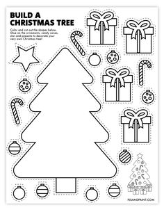 a christmas tree cut out from paper with ornaments and decorations around the tree on it