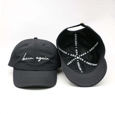 Another excellent way to "Wear What You Believe!” The “Born Again” collection debuts with our fully custom caps in classic black and white shades – making them a versatile staple for any wardrobe. This hat has both an elevated meaning and elevated style with an athletic touch. Good Form should Have Good Function: It is not necessary to compromise substance and quality for appealing aesthetics… We chose a high-grade, feather-light nylon textile with a subtle but stylish satin sheen that is antimi Brand Pattern, White Shades, Born Again, Custom Caps, Seal Logo, 6 Panel Cap, Dad Cap, Fabric Black, Dad Caps