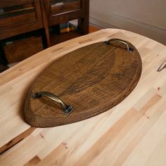 a wooden cutting board sitting on top of a table