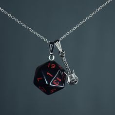 "These handmade rainbow-colored D20 charm necklaces are perfect for any Eddie fan, cosplayer, or enthusiast! Length Charm: 2cm  Material charms: zinc alloy, Resin Material chain: Sterling Silver, Stainless Steel 18K Gold Plated, Stainless Steel, Stainless Steel Gunmetal, Leather Cord and Iron (Color: Gold, Silver, Bronze, Gunmetal) Pictures are taken with \"Short\"(45cm / 17,7 inch) length necklace chains Length Necklace chains:  Choker/ 35cm/ 13,8 inch Short/ 45cm / 17,7 inch  (Leather Cord Lengths) Mid / 55cm / 21,6 inch Long / 65cm / 25,6 inch Custom length options are available! ♦️colors might be different due to light and angle♦️ Prio German shipping/Tracked shipping everywhere else Free Shipping on orders over 35€ worldwide with code \"ISHIPIT35\"!" Black Fandom Jewelry Gift, Black Fandom Inspired Jewelry Gift, Fandom Style Black Jewelry Gift, Fandom Style Personalized Jewelry Gift, Personalized Fandom Jewelry Gift, Music-themed Charm Jewelry As A Gift, Black Music-themed Jewelry For Gift, Music-themed Charms Jewelry As Gift, Music-themed Charms Jewelry For Gifts