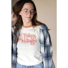 It Takes a Village Retro Ringer Tee Because we are all better when we support each other. Fun Facts: Made with 100% Organic Cotton Dyed using non-toxic dyes Care: To keep your tee fitting its best overtime, we recommend washing on cold and hanging to dry (as cotton is prone to slight shrinkage when machine dried) Screen printed by hand using eco-friendly water-based inks Fit: We're all about rocking them a little oversized, so we recommend ordering your standard size. To be on the safe side, you Elevated Basics, Ringer Tee, Baby & Toddler Clothing, Favorite Shirts, Toddler Outfits, Fun Facts, Screen Printing, Dye, Organic Cotton