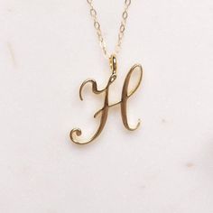 H Initial Necklace - Cursive "H" initial gold pendant - Personalized initial gold pendant for women / Gift for her / for mom / for wife / Dainty "H" initial. Perfect every day necklace. Lovely gift for your self, sister, bridesmaids, new mom. Pendant: Base metal is brass and 14K gold plated. Chain is 18 inches, 14k gold filled. Note: model shots might show a different initial, only to illustrate overall look and length of the chain. This listing is for the "H" initial. Letters Cursive, Gold Initial Pendant, Gold Letter Necklace, Jewelry Clothing, English Alphabet, Initial Necklace Gold, Initial Pendant Necklace, Personalized Bridesmaid Gifts, Capital Letters