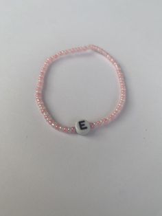 Pink & Pearl Initial Bracelet Perfect for a gift or even yourself! Why not get matching with all your friends? ---------------------------------------------- Handmade with love Cheap Pink Friendship Bracelets With Letter Beads, Pink Wristband With Letter Beads As Gift, Initial Bracelet Beads, Pink Beads Bracelets, Necklaces With Beads, Bracelet Business, Pink Beaded Bracelets, Bracelet Initial, Bracelets Design