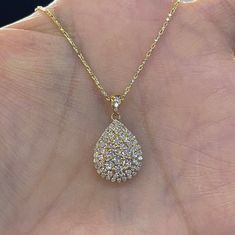 "Beautiful Pear Shape Diamond Necklace set in yellow gold. The diamonds are clear and very sparkling. Elegant and classy shape necklace. It's a nice size pendant, great to wear for any occasion. The diamond cut 14K Yellow Gold Chain has a nice sparkle to it and compliments the pendant perfectly. The chain is solid so it is strong. 18\" chain, let us know if you need a different length chain. Pendant length measures 22mm. The pear shape measures 16.2x12.5mm. Genuine Round Brilliant Cut Diamonds t Elegant Gold Diamond Necklace With Pear-shaped Pendant, Elegant Gold Pear-shaped Diamond Necklace, Yellow Gold Drop Necklace With Prong Setting, Gold Teardrop Diamond Necklace With Prong Setting, Gold Pear-shaped Diamond Necklace For Formal Occasions, Gold Pear-shaped Diamond Necklace For Anniversary, Gold Teardrop Diamond Necklace With Vvs Clarity, Gold Pear-shaped Diamond Necklace For Wedding, Gold Pear-shaped Diamond Necklace With Accents