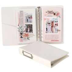 a white binder with photos inside it