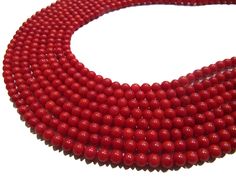 Beautiful Red Coral Round Shape Beads Plain Smooth Ball Shape Red Coral Beads Size 6-7mm Sold per Strand 15-16 inch Long Wholesale Price Precious Stones Size : 6-7mm Color: Red Shape : Round These are top Quality Gemstone Beads . Measurements and weight are close approximations. Great Quality for making Necklace, earrings, Bracelet or any other jewelry. The photographs of the items have been taken in natural daylight, without any enhancements or affects and all attempts have been made to depict Red Coral Beaded Necklaces With Spacer Beads, Red Coral Spacer Beads, Round Shape, Red Coral Round Spacer Beads, Red Coral Spacer Beads, Red Rondelle Gemstone Beads, Hand-strung Red Beads For Jewelry Making, Gift Red Coral Round Beads, Gift-grade Red Coral Beads, Red Rondelle Beads For Jewelry Making