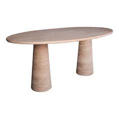 an oval table with two legs and a circular top, made out of concrete on a white background