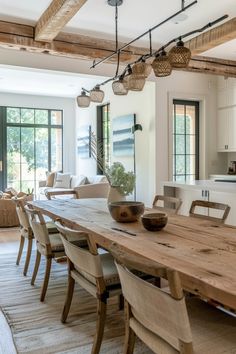 a large wooden table sitting in the middle of a living room