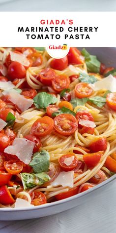 a pan filled with pasta and tomatoes on top of a table