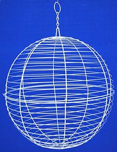 a white wire ball hanging from a blue sky with the top part of it being held by a metal hook