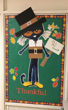 a bulletin board with a cat dressed up as a leprechaun and holding a sign that says, thank you