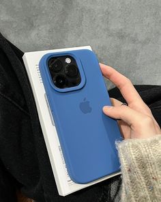 a person holding an iphone case in their hand