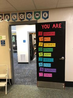 the door to an office is decorated with colorful sticky notes that read, you are