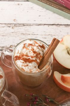 an apple cider with cinnamon and whipped cream