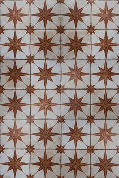 an image of a tile pattern that looks like starbursts