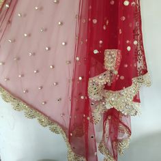 More dupatta here in our collection https://www.etsy.com/shop/neelcreations/?section_id=15880219 Net with embroidery Indian dupatta. It has beautiful golden border. Scallop border with dull gold color. ★ The mirror on all over net is not real. ★ It can be made in other colors and longer in length also. We can also change the border if you want. Approximate length 95 inches. We can increase length so please contact us if you want longer dupatta. These designer dupattas are very much in trend. Pai Festive Sharara With Dupatta In Nida, Traditional Draped Nida Sharara With Dupatta, Red Traditional Wear With Sheer Dupatta In Nida, Festive Kundan Sharara With Sheer Dupatta, Red Saree With Sheer Dupatta And Kundan Material, Red Kundan Saree With Sheer Dupatta, Festive Anarkali Dupatta In Nida, Red Lehenga With Sheer Dupatta In Chinon, Festive Anarkali Dupatta