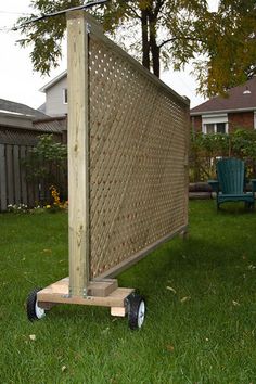 a wooden structure sitting in the middle of a yard