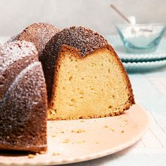 a bundt cake on a plate with powdered sugar