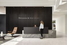 a woman standing in front of a reception desk