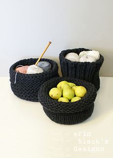 three knitted baskets with apples in them on a white counter top next to yarn balls